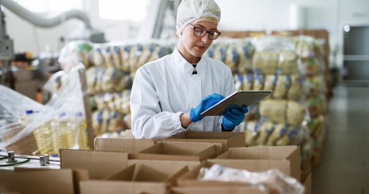 Technician inspecting production line